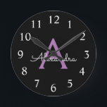 Reloj Redondo Mediano Morado Black Script Girly Monograma Nombre<br><div class="desc">Reloj de nombres de monograma de escritura simple púrpura y negra. Esto hace que el dulce perfecto cumpleaños 16,  boda,  ducha de novia,  aniversario,  ducha de bebé o fiesta de soltera sea regalo para alguien que ama el lujo glam y los estilos de moda.</div>