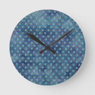 Reloj Redondo Mediano Navidades con copos de nieve sobre fondo azul