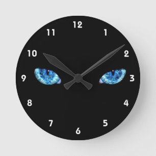 Reloj Redondo Mediano Ojos sobre fondo negro