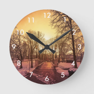 Reloj Redondo Mediano Panoramic view of snowy park during sunset in Riga