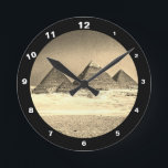 Reloj Redondo Mediano Pyramids & Desert, vintage Cairo / Ancient Egypt<br><div class="desc">CLOCKS - Ancient Pyramids in Egypt vintage art. View on all of the pyramids in line is highlighting magnificence of the area. Top of Great Pyramid is still covered with flat decorative stone desks and let us imagine, what amazing view it must have been in the times of their peak....</div>