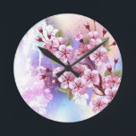Reloj Redondo Mediano Sakura rosa sobre fondo de pintura<br><div class="desc">Dibujado artísticamente,  rama de rosa,  flores de cerezo sobre fondo pintoresco,  texturizado,  pintado con pintura blanca,  rosa y azul. Pink Sakura</div>