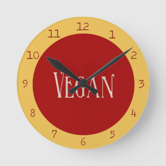 Reloj Redondo Mediano Vegano en un círculo rojo