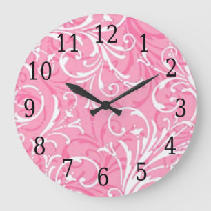 Reloj redondo ornamental rosado