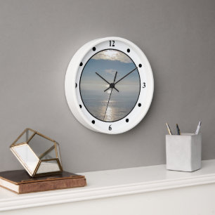 Reloj - Reflejos del sol en el océano