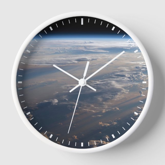 Reloj Sunrise arroja largas sombras sobre el mar de Fili (Anverso)