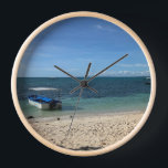 Reloj Tropical Blue Ocean Beach & Boat:Summer Wall Clock<br><div class="desc">Escape to a serene tropical paradise with this stunning photograph of a crystal-clear blue ocean and a peaceful boat resting near the shore. The pristine white sand and the gentle gradient of the sea create a calming, minimalist aesthetic. Perfect for adding a touch of summer vacation to your phone case,...</div>