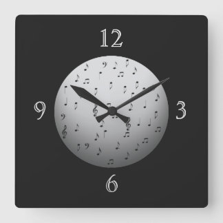 Relojes de pared de notas musicales en blanco y ne
