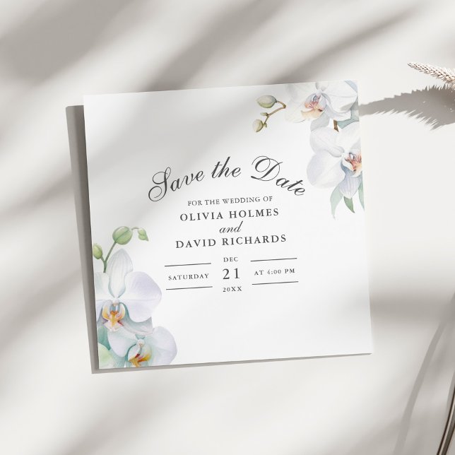 Reserva La Fecha Elegante y moderno Orquídea Blanca Guardar la tarj (Modern Elegant White Orchid Save the Date Card on a sunny white table.)