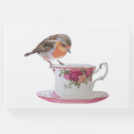 Robin en un libro de invitados para un té