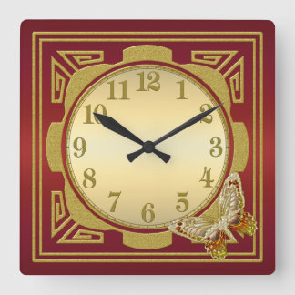 Rojo y reloj de pared de la mariposa del oro