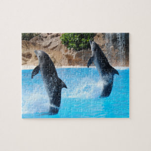 Rompecabezas de delfines dobles con cascada