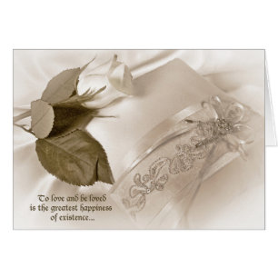 rosa blanco sobre almohada boda