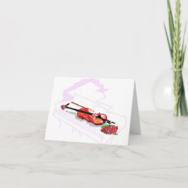 Rosa de violín de tarjeta de nota en piano