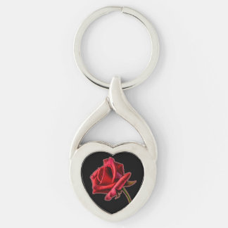Rosa rojo torcido del corazón en llavero negro