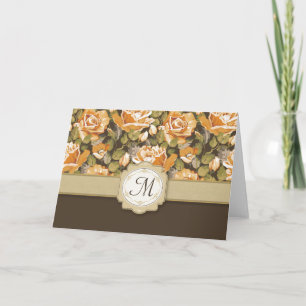 Rosas amarillos del oro en Brown con el monograma