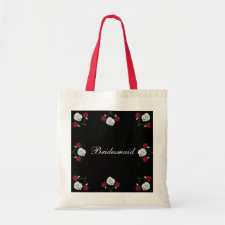 Rosas rojos y blancos que casan la bolsa de asas