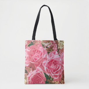 Rosas rosados elegantes en la bolsa de asas de la