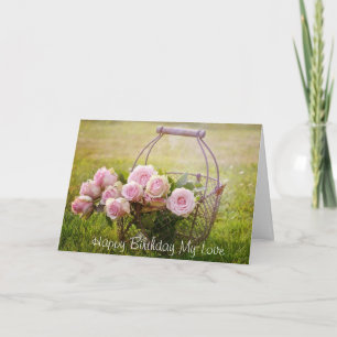 Rosas rosados i una cesta, tarjeta de cumpleaños