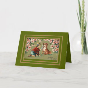 Saludos de cumpleaños de niño y perro con tarjeta 