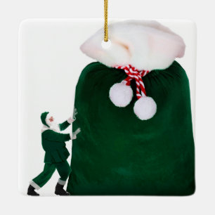 Santa con enorme ornamento de saco de regalo