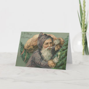 Santa con una tarjeta de Navidad del saco