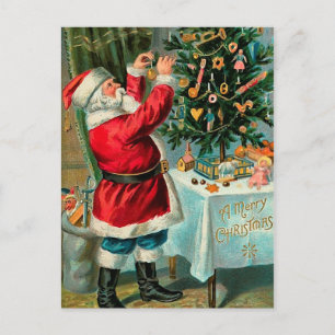 Santa decorando el árbol de Navidad