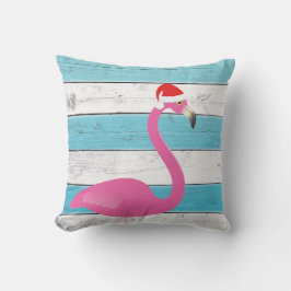 Santa Flamingo sobre almohada a rayas al aire libr