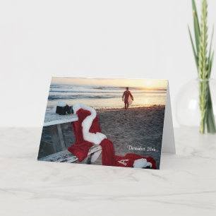Santa practica surf el día después del navidad