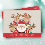 Santa y la Navidad de la Plana de Renos<br><div class="desc">Santa y sus renos aparecen con Feliz Navidad en la parte delantera y tu saludo personal y nombres de vuelta. Seleccione Matte para papel más pesado y alta definición para obtener la mejor calidad de impresión.</div>