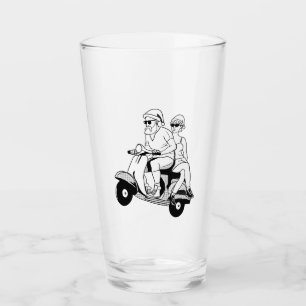 Santa y la Sra. Claus montando una moto