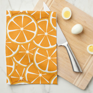 Secciones de naranja, toallas de cocina de fruta