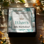 Servilleta De Papel Acuarela Ocean Kids Nautical Birthday<br><div class="desc">Añada un toque náutico encantador al día especial de su pequeño con estas toallas personalizadas de Watercolor Ocean Scene. Con delicados ilustraciones acuáticos de pequeños barcos, algas suaves, conchas pastel y peces suaves, este diseño trae la tranquilidad del mar a su celebración. Personalizar con el nombre y edad de cumpleaños...</div>