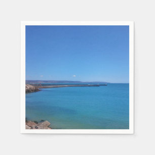 Servilleta de papel de paisaje de cielo azul y océ