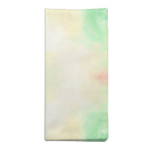 Servilleta de tela doblada con un suave tie-dye pa