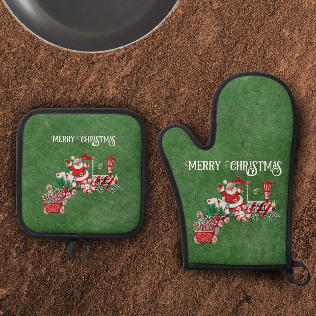 Set De Manoplas Navidades de Santa Drin entrenan verde oscuro (Santa driving Merry Christmas train with candy and letters on dark green holiday potholders.)