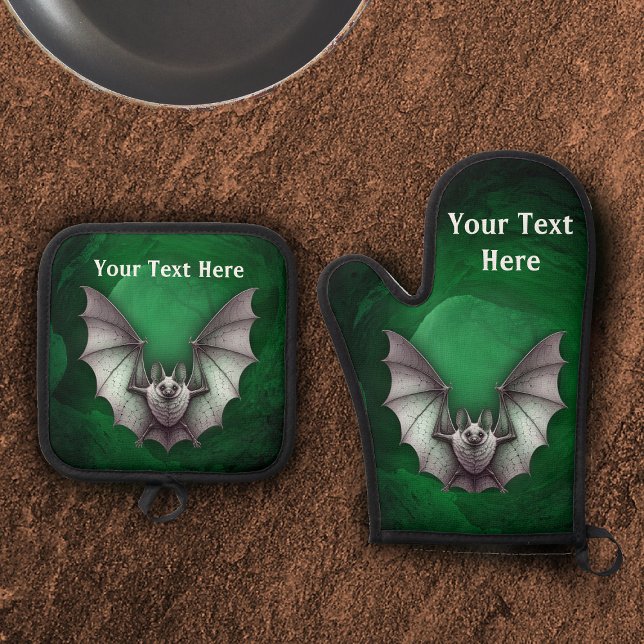 Set De Manoplas Spooky Gray Flying Bat Glowing Green Cave (Spooky grey bat wings spread in flight glowing green cave with trees on oven mitt and potholder.)