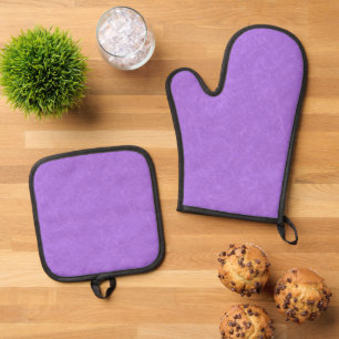 Set De Manoplas Superficie morada texturizada con patrón de remoli