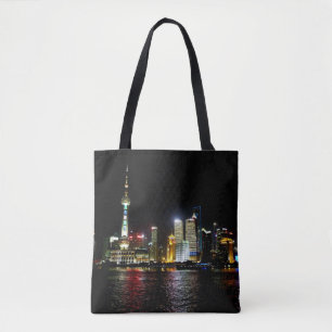Shanghai de noche en la bolsa de la tote