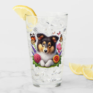 Sheepdog de Shetland con flores y mariposas