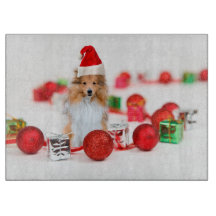 Sheltie con la tabla de corte de Ornamentos de Nav