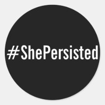 #ShePersistent, texto blanco sobre pegatinas negro