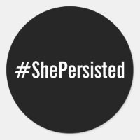 #ShePersistent, texto blanco sobre pegatinas negro