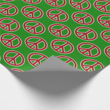 Signos de la paz rojos en el papel de regalo verde