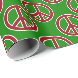 Signos de la paz rojos en el papel de regalo verde