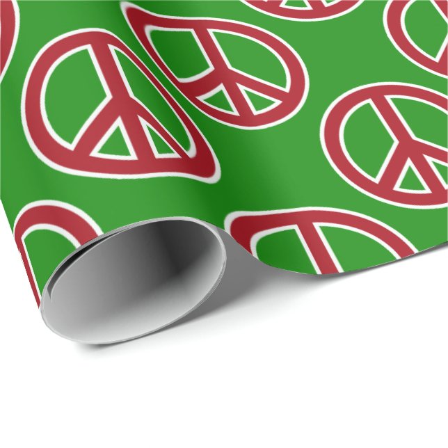 Signos de la paz rojos en el papel de regalo verde (Esquina del rollo)