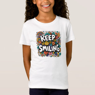 Sigue sonriendo la camiseta positiva de los niños