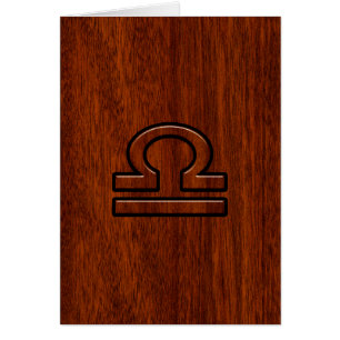 Símbolo libra zodiaco sobre caoba