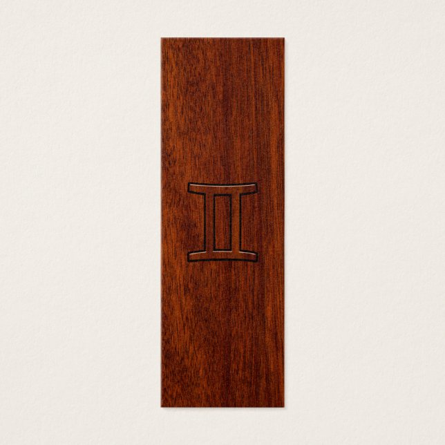 Símbolo zodiaco génito sobre caoba como decoración (Frente)