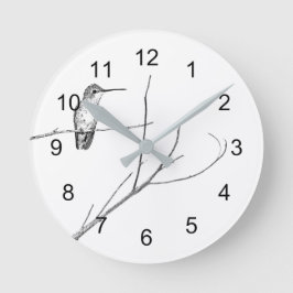 Simplemente un colibrí en un reloj de pared cuadra